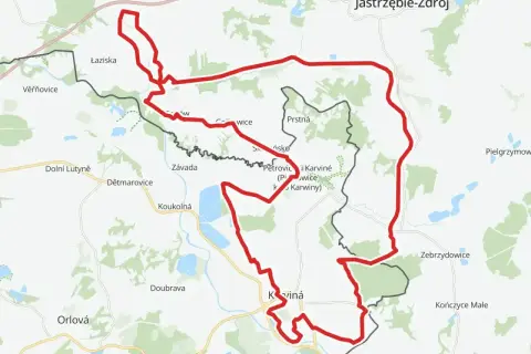 Mapa z zaznaczoną na czerwono żelazną trasą rowerową, biegnącą przez tereny zurbanizowane i zielone, w okolicach Karwiny i Jastrzębia-Zdroju.